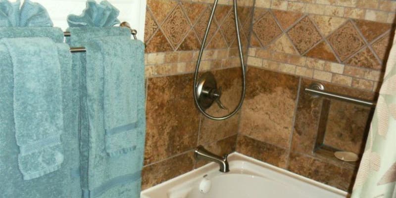 photo of towels and tub and tile in bathroom